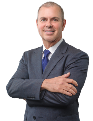 Professional man in a suit smiling with arms crossed.