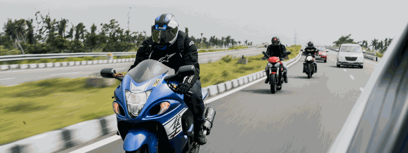 Motorcyclists riding on a highway.