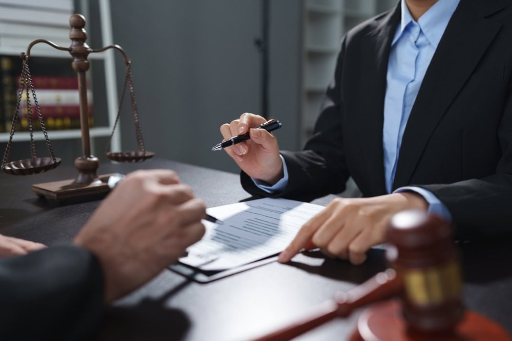 Photo of a Lawyer and a Client