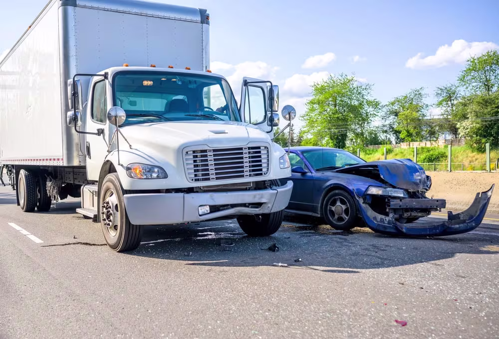 Split image showing damaged passenger car and commercial truck after collision, highlighting the differences between car and truck accident claims