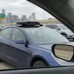 autonomous waymo type of vehicle in traffic