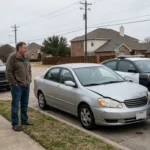 A man and a police officer discuss UM/UIM coverage next to a small wreck.