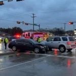 When do most car accidents happen? In situations like these, with a two-car pileup at a busy, rain-soaked intersection.