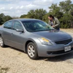 A person checks if they have windshield damage insurance after their windshield became cracked.